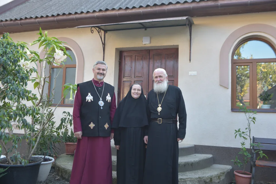People from the community beside the church entrance.